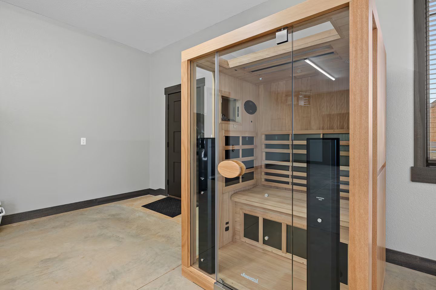 Infrared sauna with a glass front and a wood interior